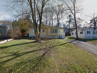 Foreclosed Home - 22 WOODYCREST TRL, 10950