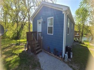 Foreclosed Home - 5811 SE WAUKOMIS DR, 64465